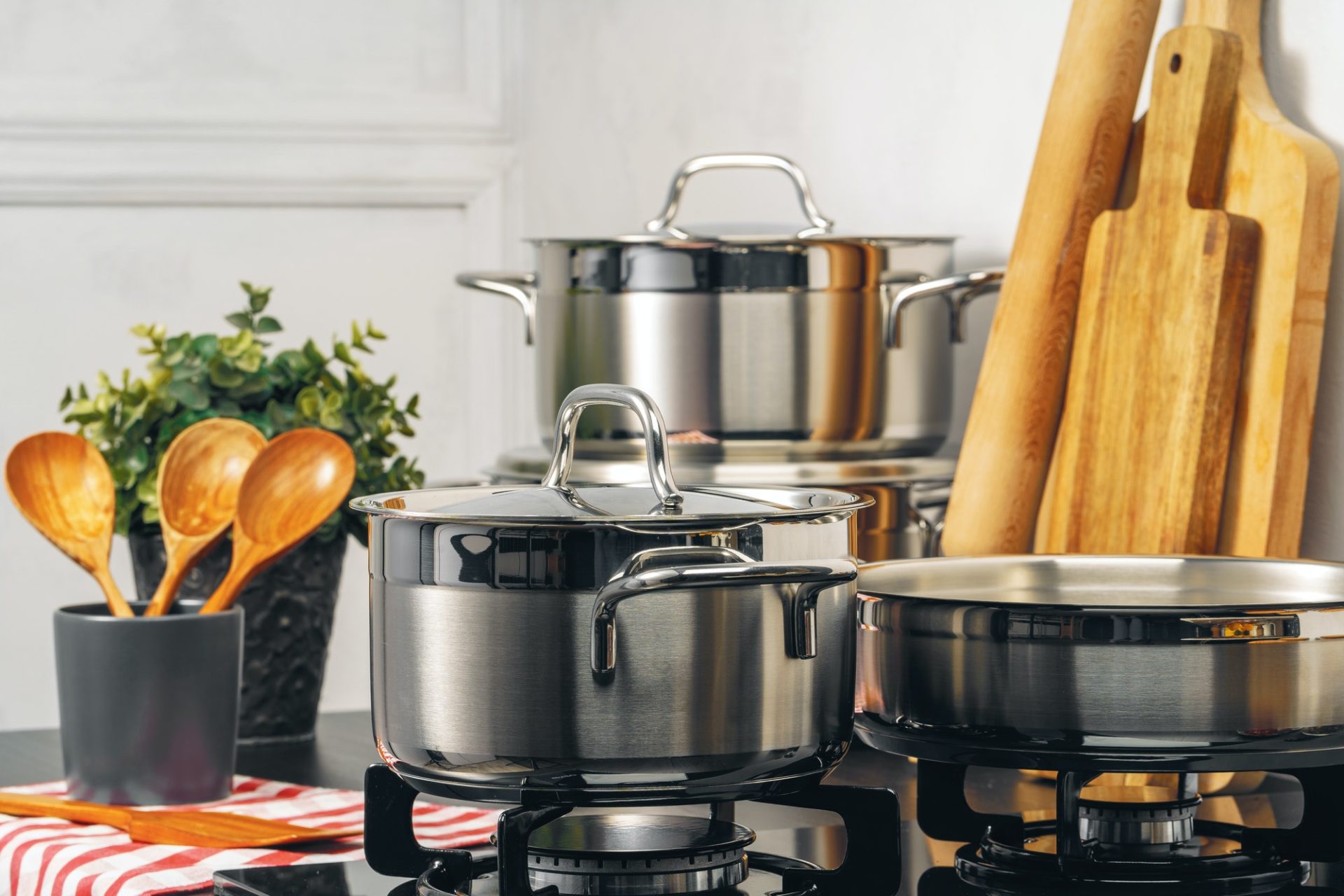 Clean stainless steel saucepan on gas stove for wholesale kitchen use